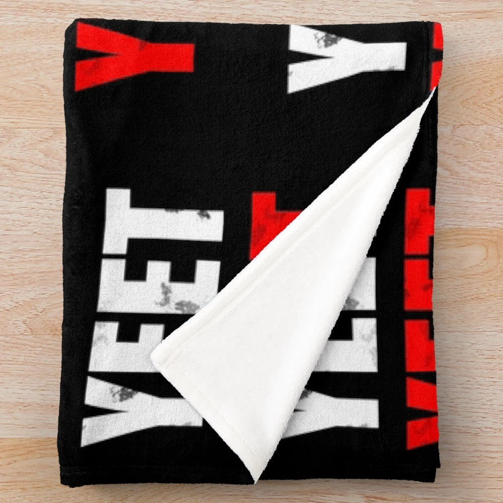 Plush yeet blanket with a distressed, vintage-inspired design