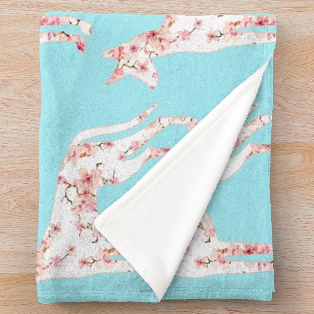 Podenco dog breed on a soft, plush cherry blossom blanket