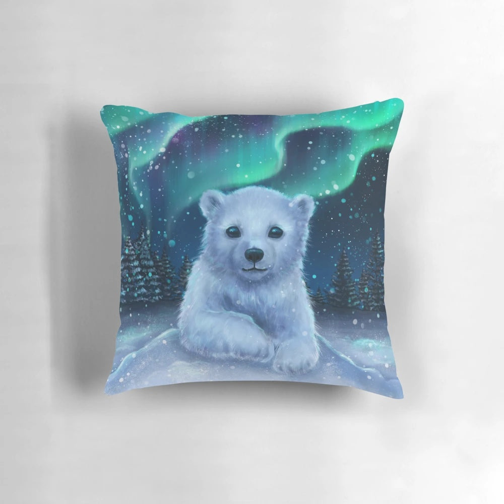 A soft, plush polar bear pillow with a beautiful night sky and aurora borealis design