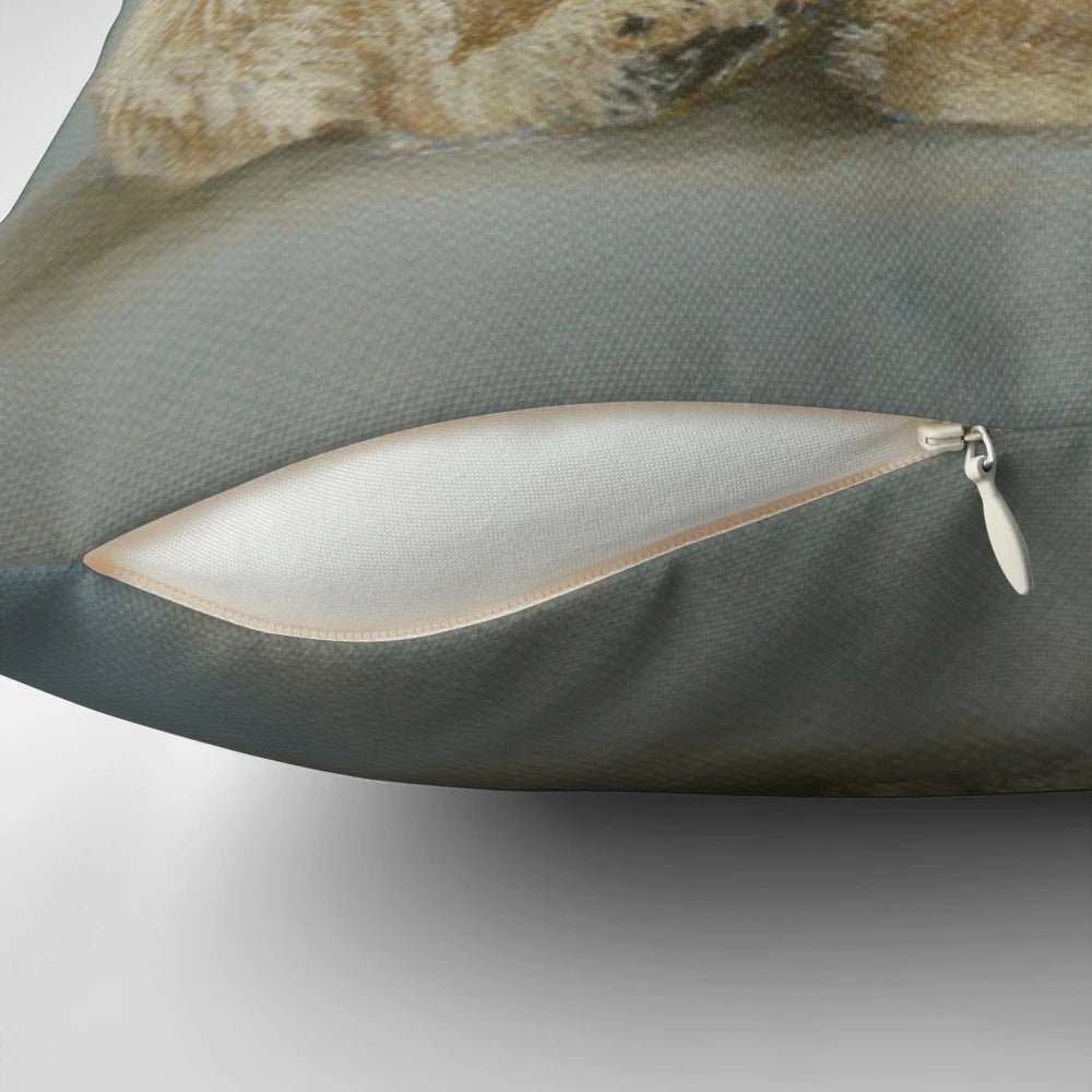 A soft and plush pillow featuring a painting of a polar bear sitting in a winter landscape by artist Carole Russell.