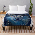 Pomsky puppy on a plush blue and white blanket