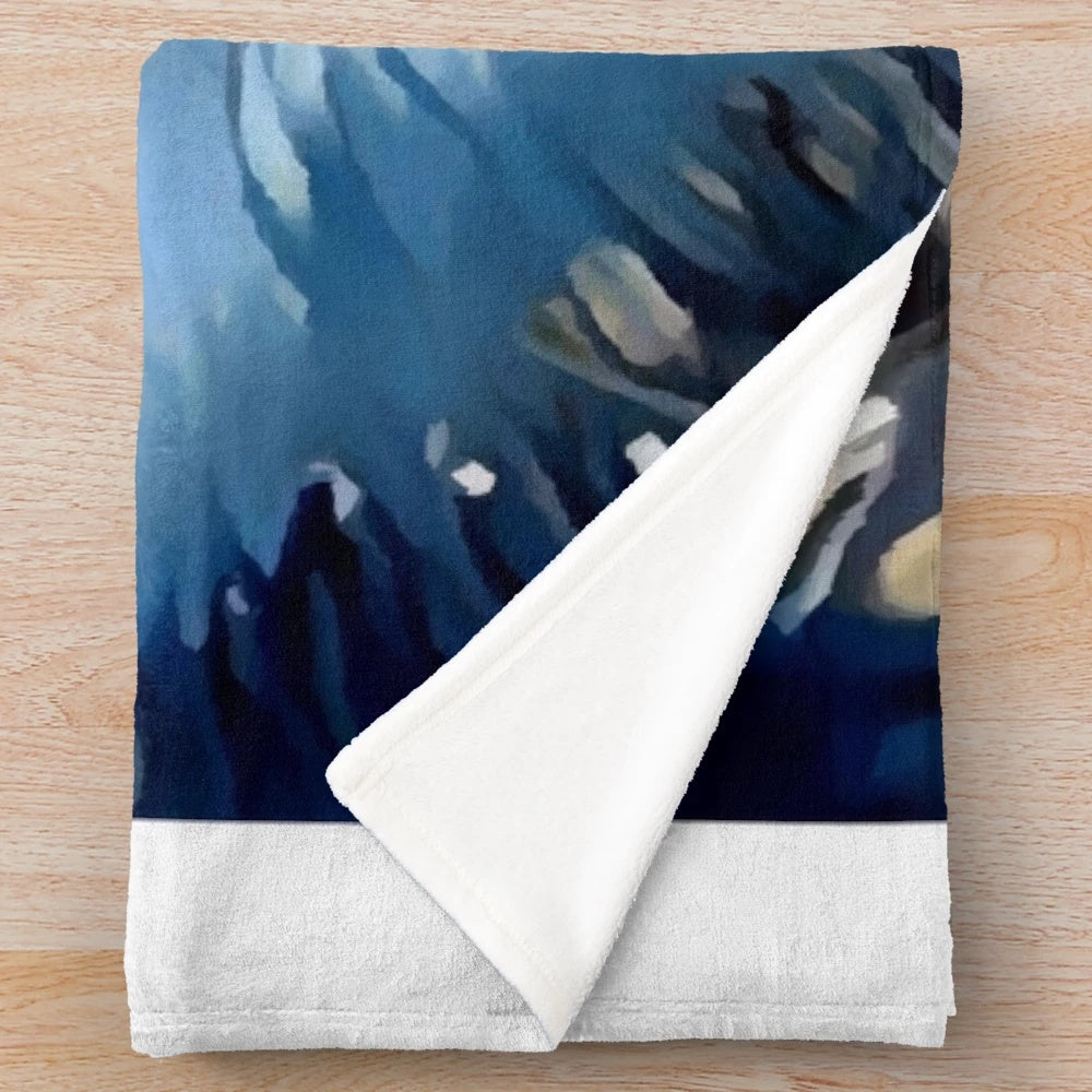 Pomsky puppy on a plush blue and white blanket