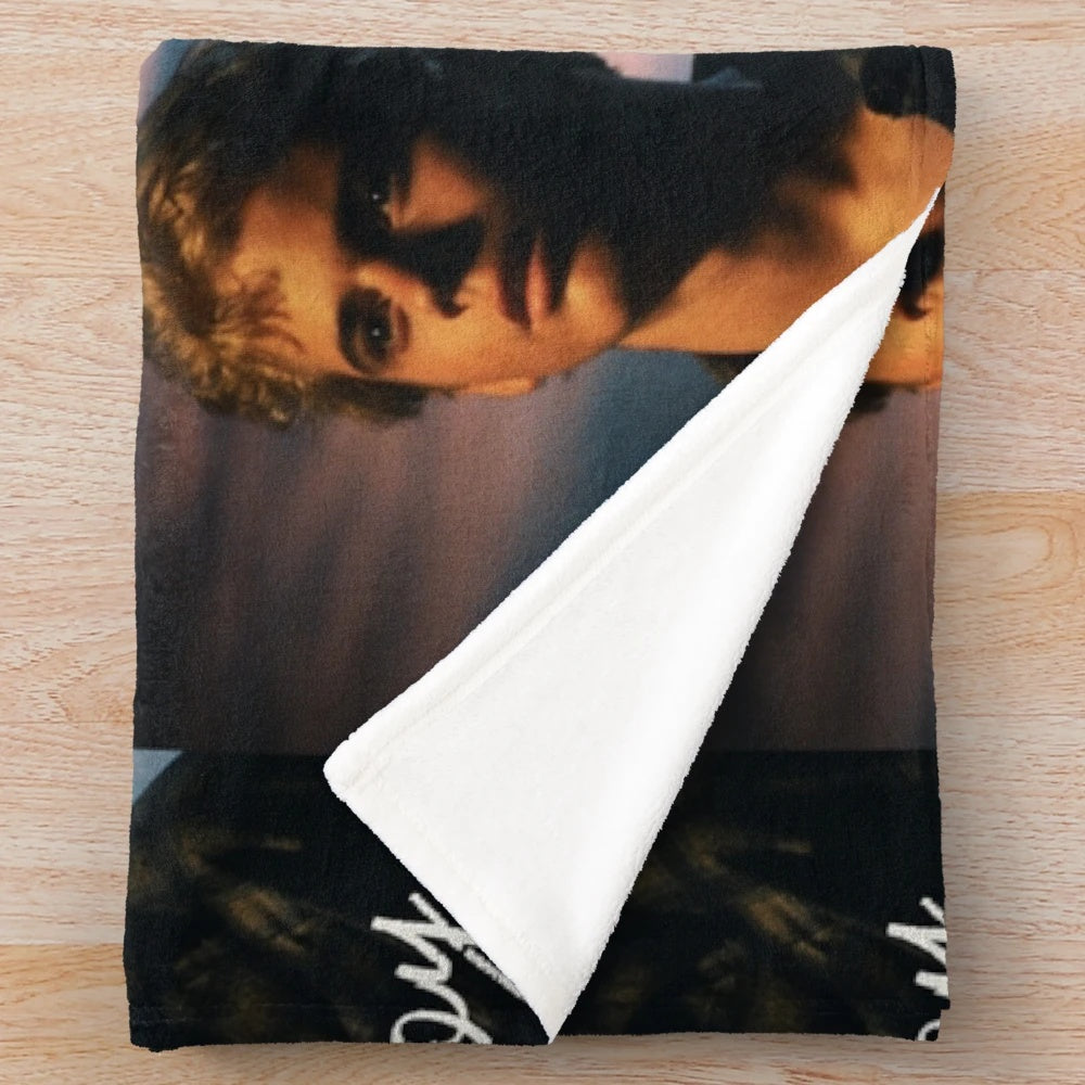 Ponyboy Curtis from The Outsiders movie on a plush blanket