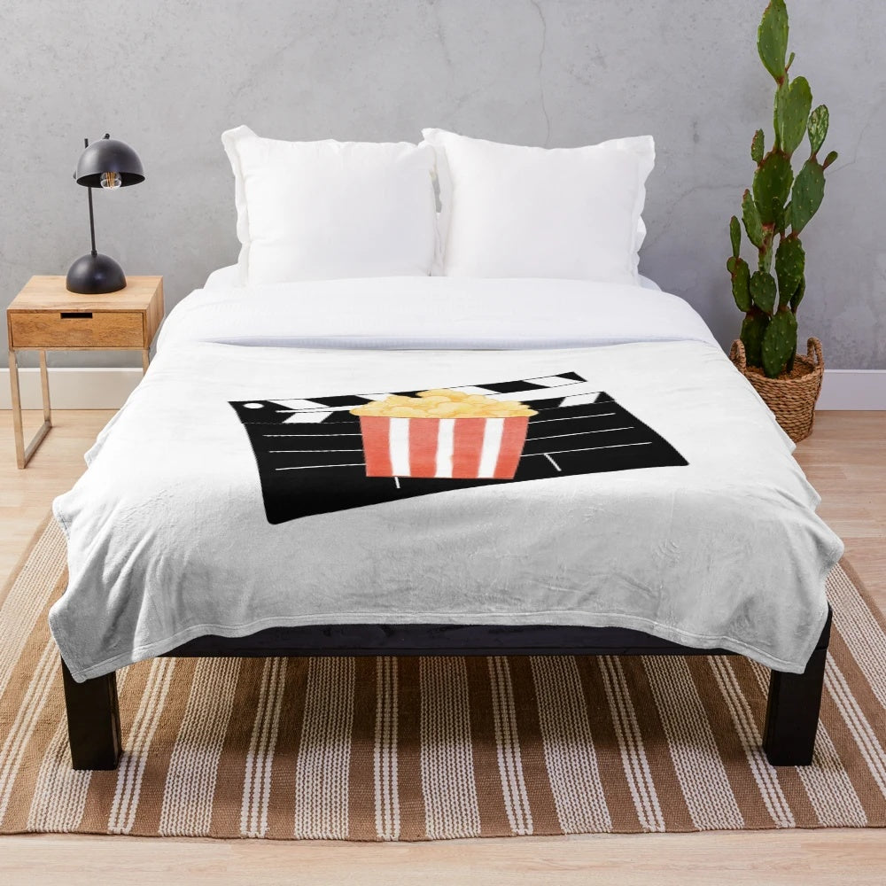 Popcorn cinema-themed plush blanket for cozy movie viewing