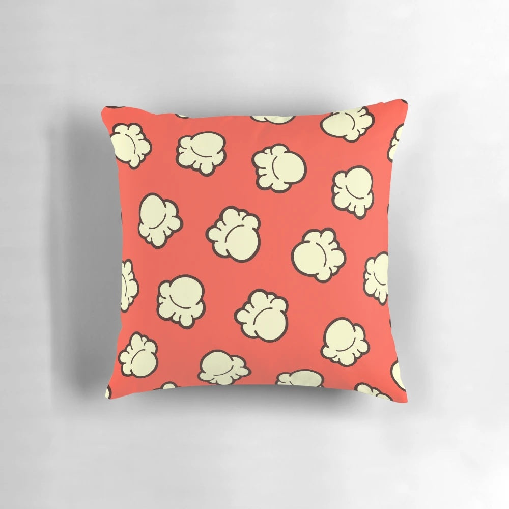 Handdrawn popcorn pattern design on a soft, textured pillow perfect for home decor and movie nights.