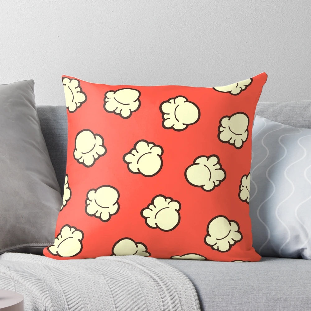 Handdrawn popcorn pattern design on a soft, textured pillow perfect for home decor and movie nights.