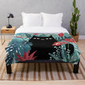 Popoki plush blanket featuring tropical Hawaii inspired floral pattern with anthurium and plumeria flowers