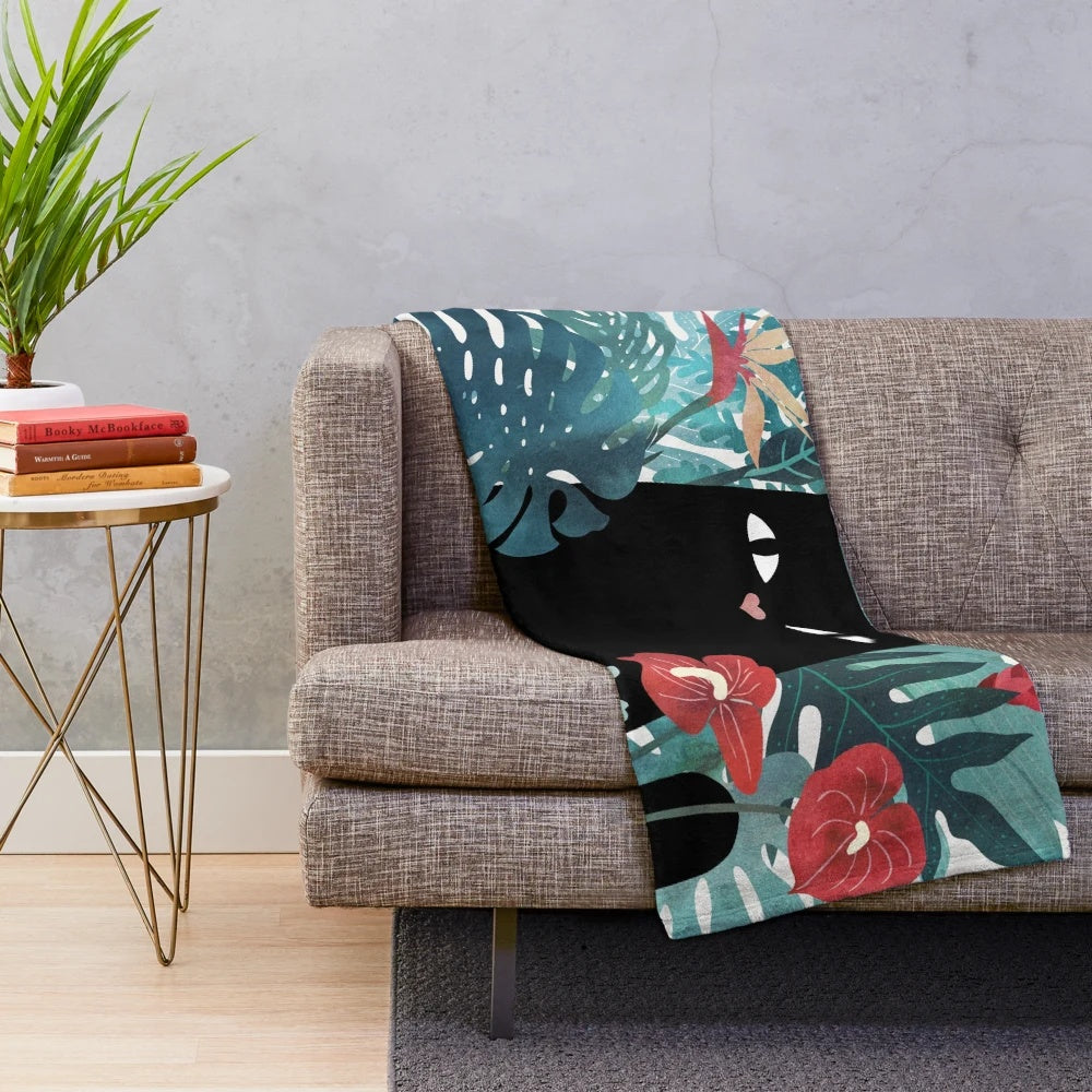 Popoki plush blanket featuring tropical Hawaii inspired floral pattern with anthurium and plumeria flowers