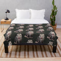 Possum plush blanket with a happy, yawning possum design