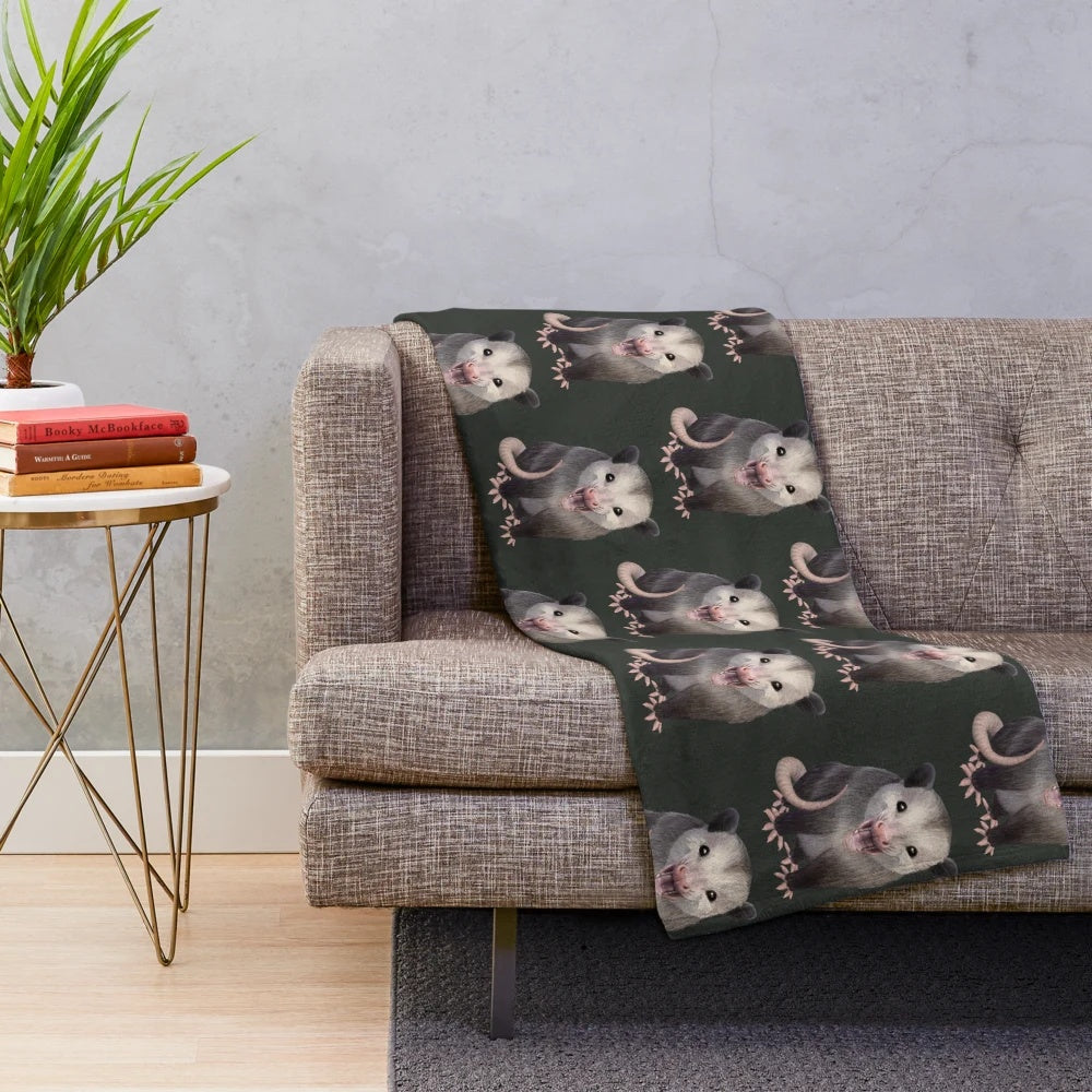 Possum plush blanket with a happy, yawning possum design
