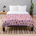 Soft and cuddly pink plush blanket with princess-inspired swirl pattern