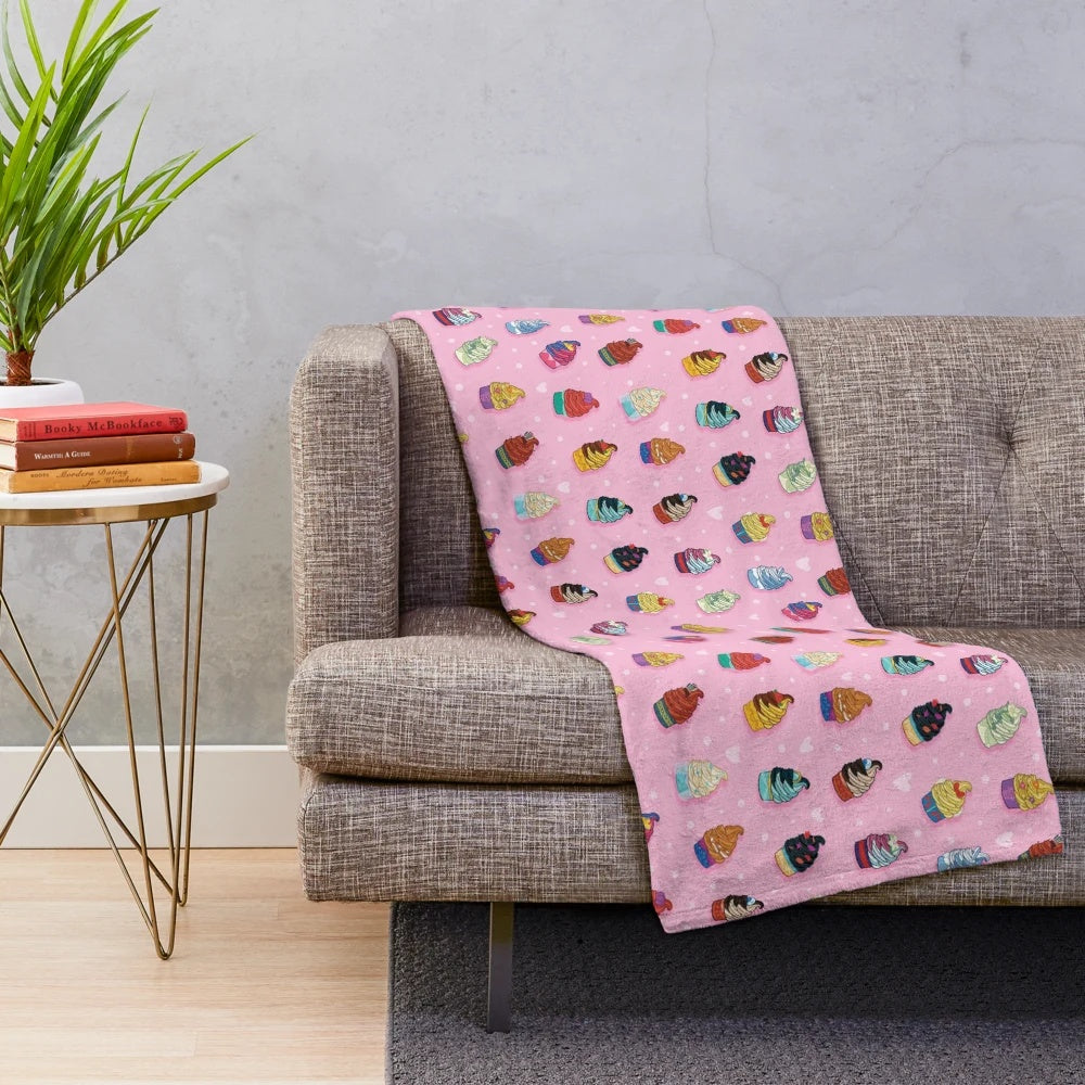 Soft and cuddly pink plush blanket with princess-inspired swirl pattern