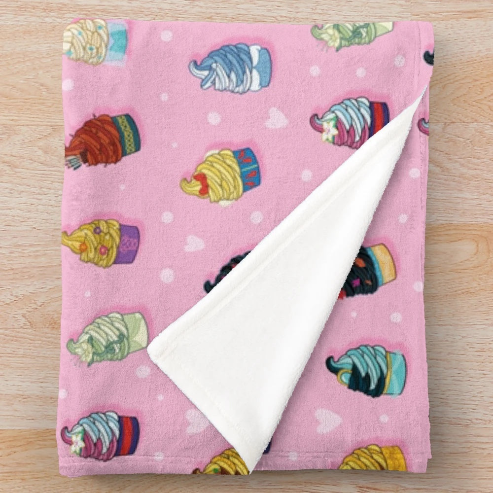 Soft and cuddly pink plush blanket with princess-inspired swirl pattern