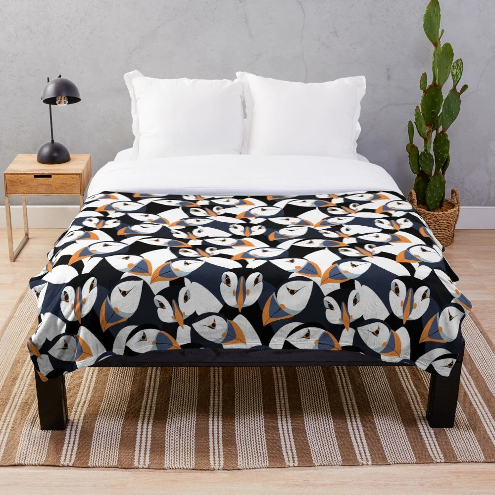 Puffin plush blanket with orange beaked puffins in a colorful pattern