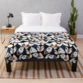 Puffin plush blanket with orange beaked puffins in a colorful pattern