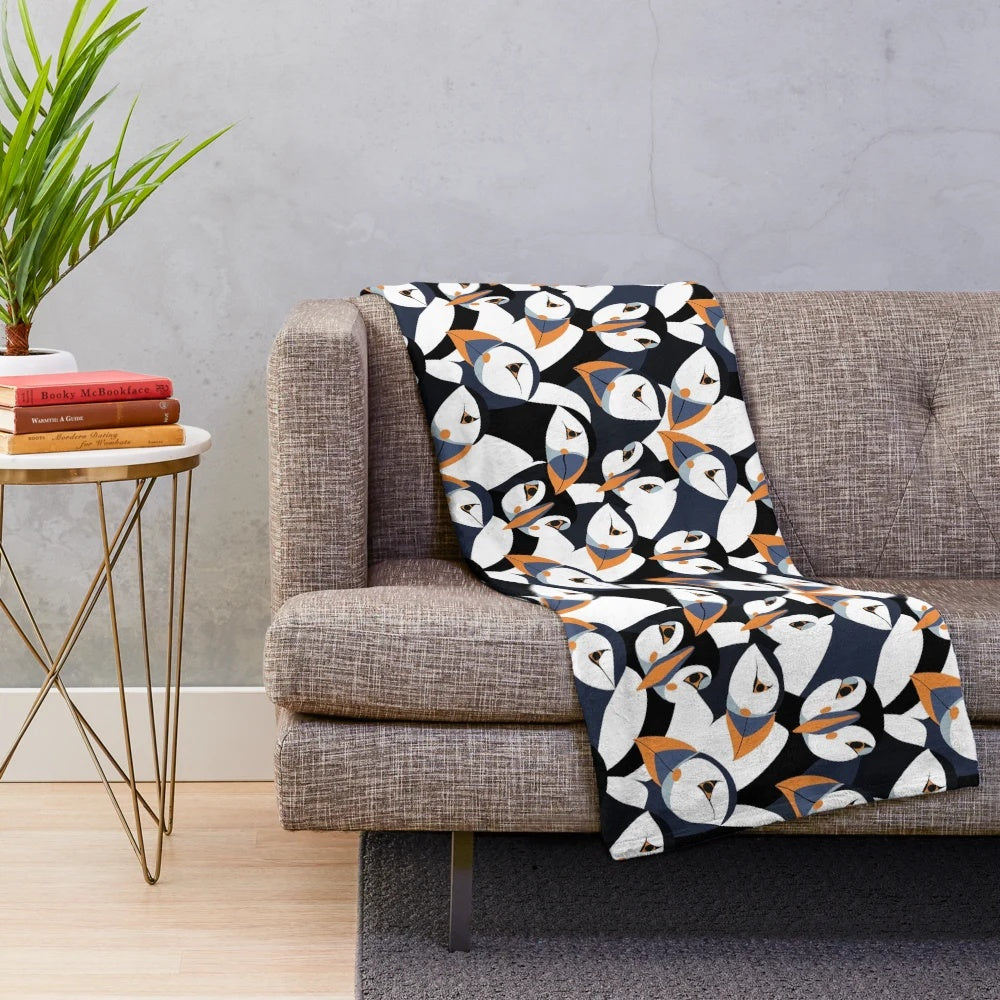 Puffin plush blanket with orange beaked puffins in a colorful pattern