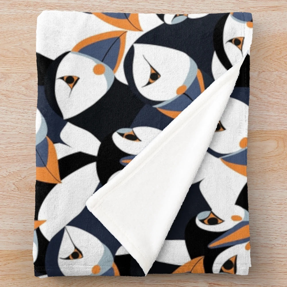 Puffin plush blanket with orange beaked puffins in a colorful pattern