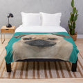 Teal pug plush blanket with pug face design