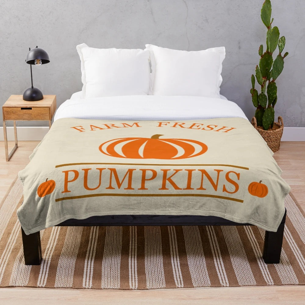 Cozy pumpkin-themed plush blanket for autumn and Thanksgiving decor