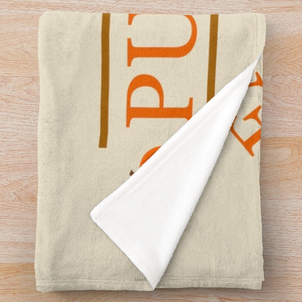 Cozy pumpkin-themed plush blanket for autumn and Thanksgiving decor