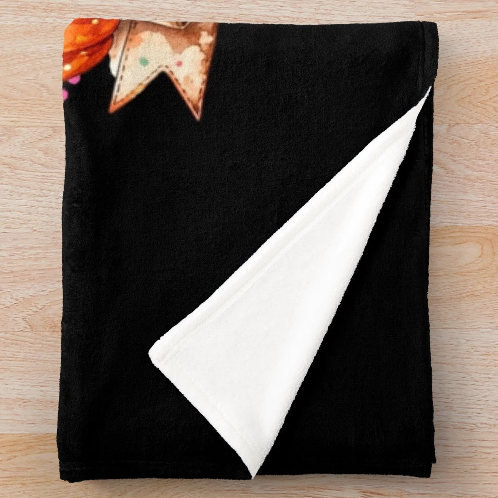 Whimsical pumpkin season artwork featured on a plush, cozy blanket