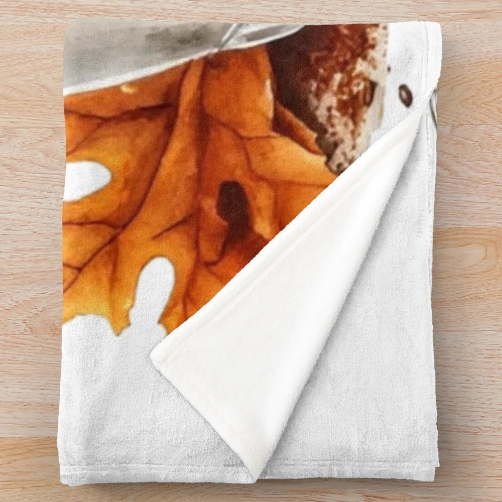 Pumpkin spice latte-themed plush blanket with fall leaves and cozy vibes
