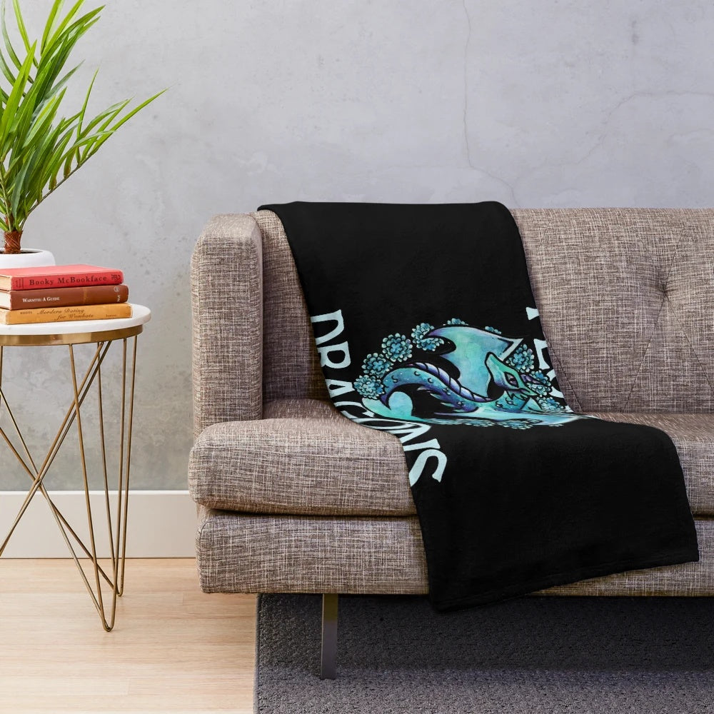 Plush dragon-themed blanket in a soft, purple color