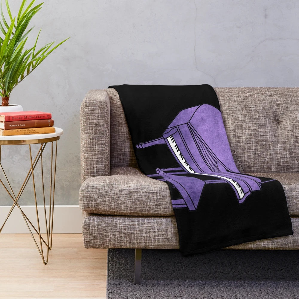 Purple piano plush blanket with musical instrument design