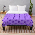 Purple plush blanket with various hobby-related patterns