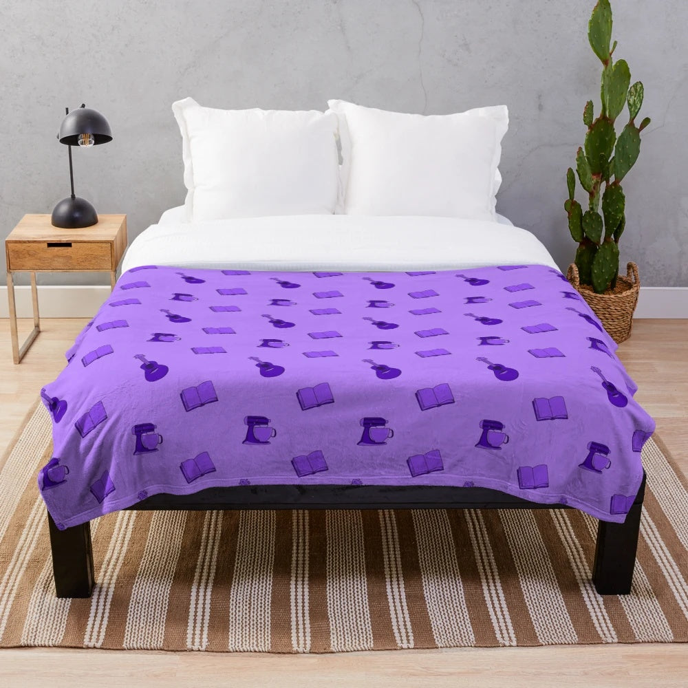 Purple plush blanket with various hobby-related patterns