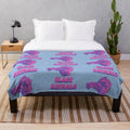Purple plush blanket with Glass Animals head and logo design