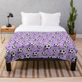 Purple soccer-themed plush blanket with soccer ball and goal pattern