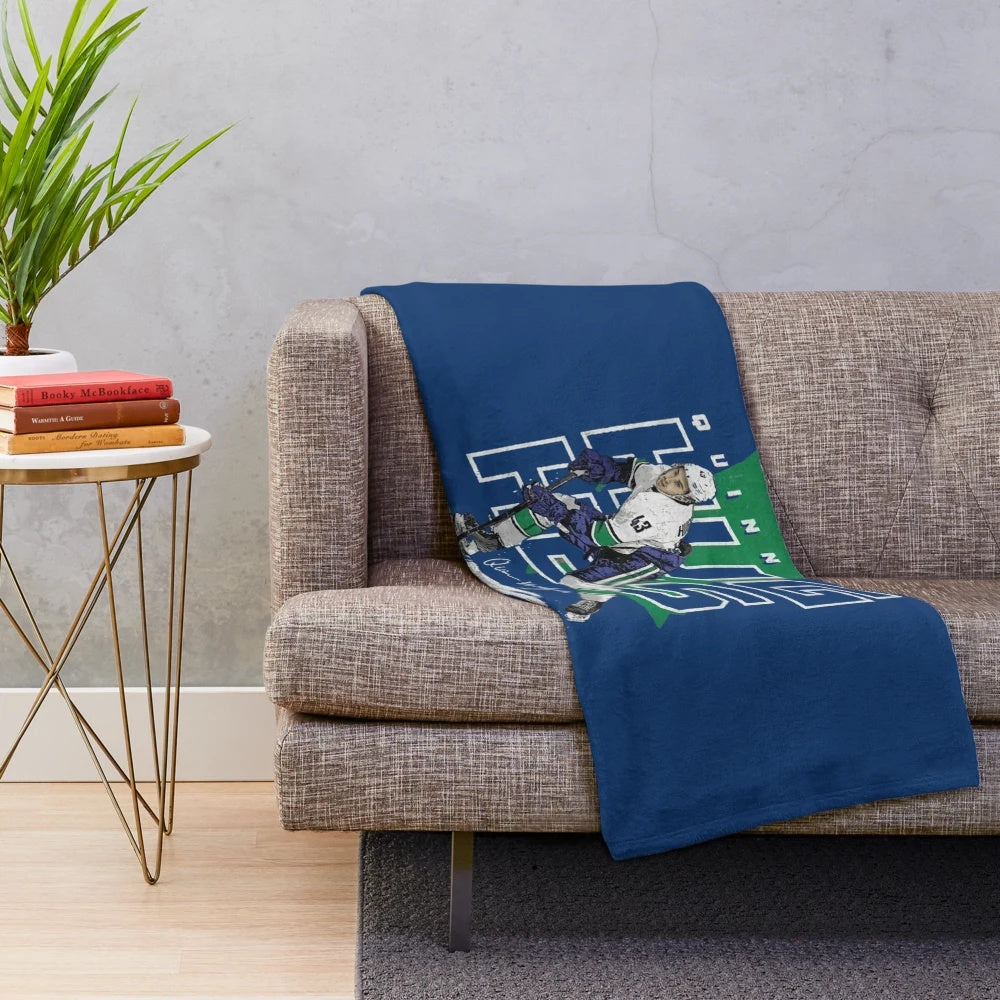 Plush blanket featuring Quinn Hughes of the Vancouver Canucks