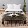 Soft and plush raccoon-patterned blanket