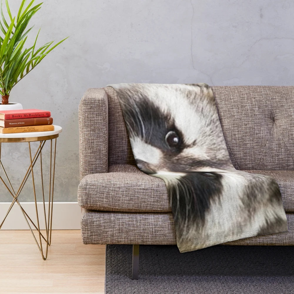 Soft and plush raccoon-patterned blanket