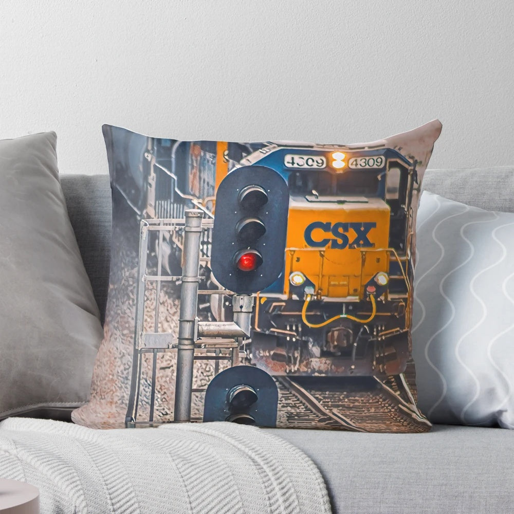 A vibrant red pillow with a railroad or train theme, perfect for adding a touch of industrial chic to your home.