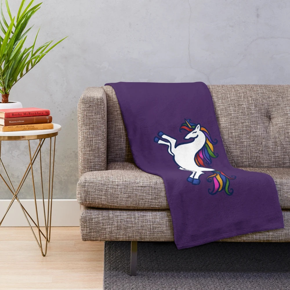 Rainbow-colored unicorn plush blanket