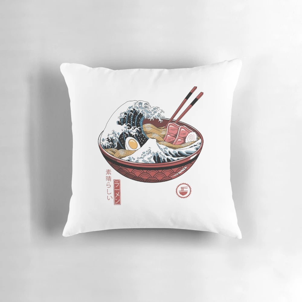 A white pillow featuring the iconic Great Wave off Kanagawa artwork, representing Japanese culture and ramen.