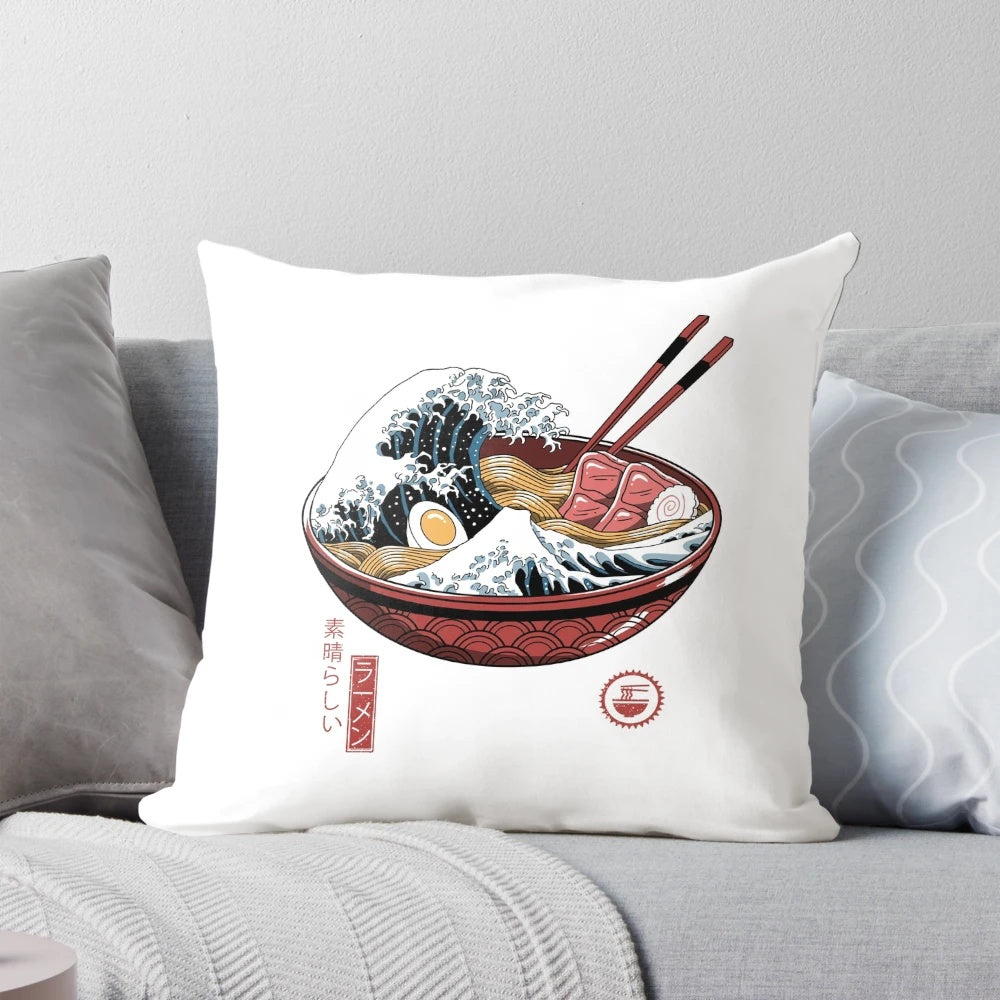 A white pillow featuring the iconic Great Wave off Kanagawa artwork, representing Japanese culture and ramen.