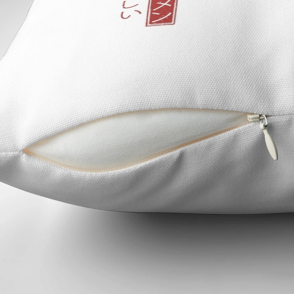 A white pillow featuring the iconic Great Wave off Kanagawa artwork, representing Japanese culture and ramen.