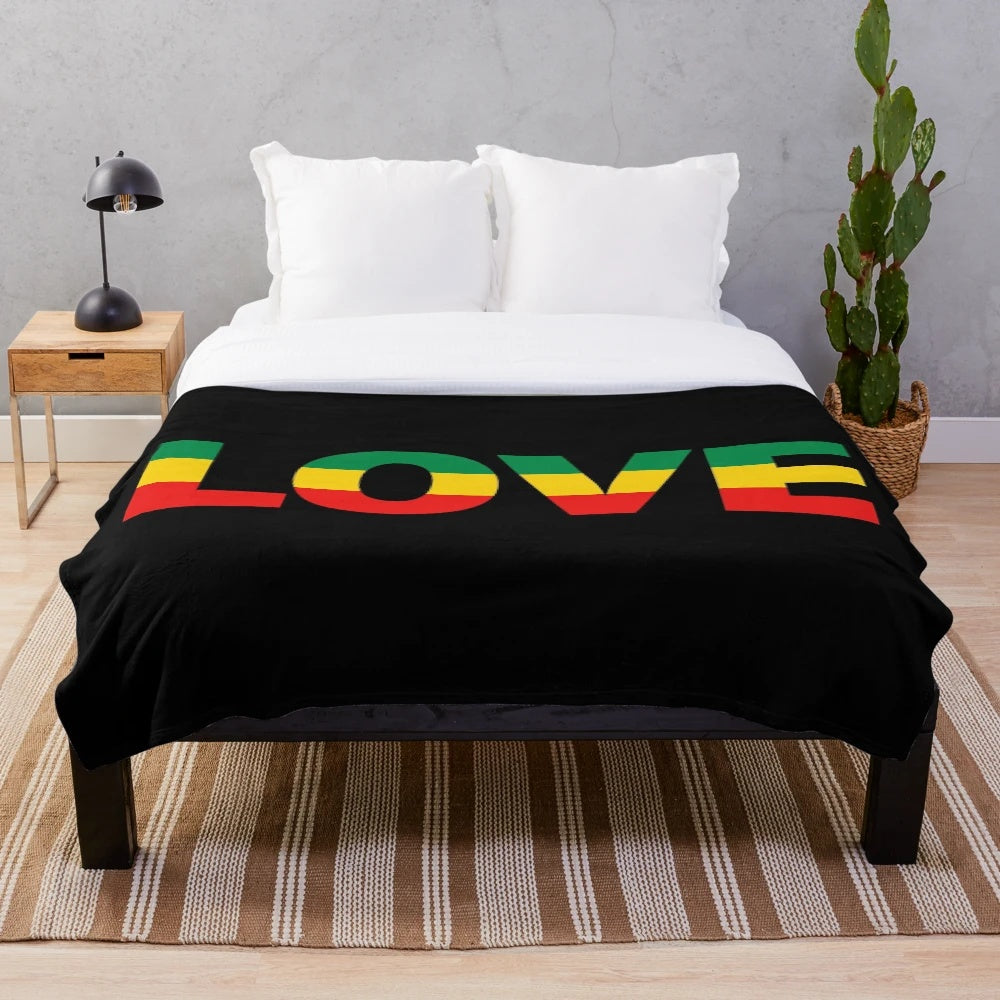 Rasta-inspired plush blanket with Jamaican reggae and peace symbols