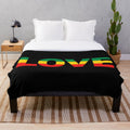 Rasta-inspired plush blanket with Jamaican reggae and peace symbols