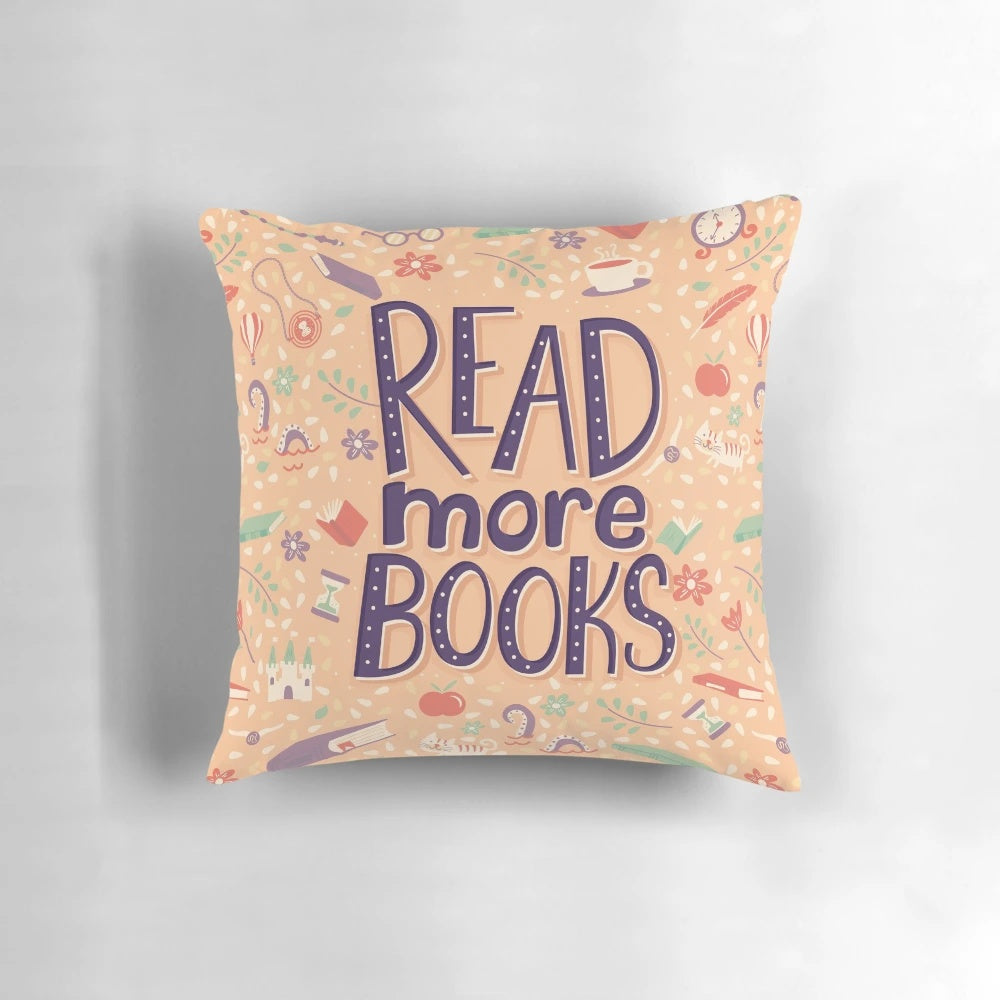A white pillow with the text "Read More Books" in a stylish font
