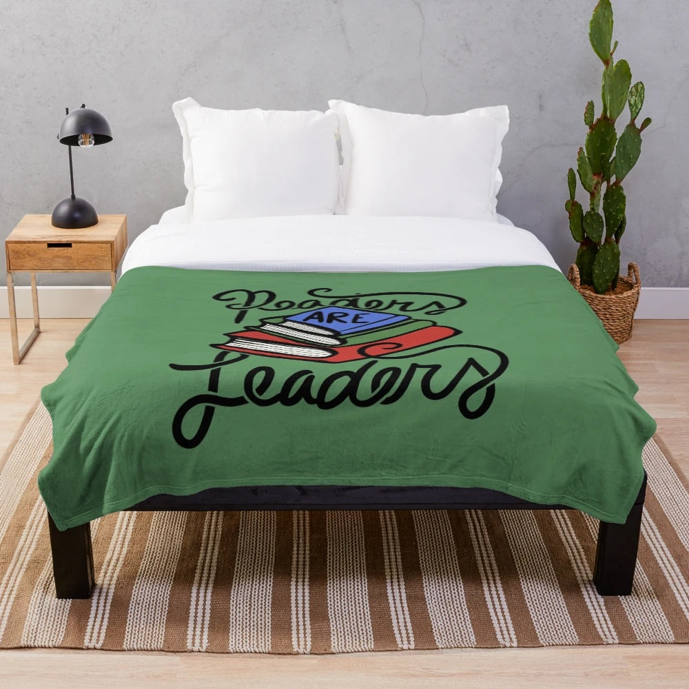 Soft, plush blanket featuring the "Readers Are Leaders" design for book lovers