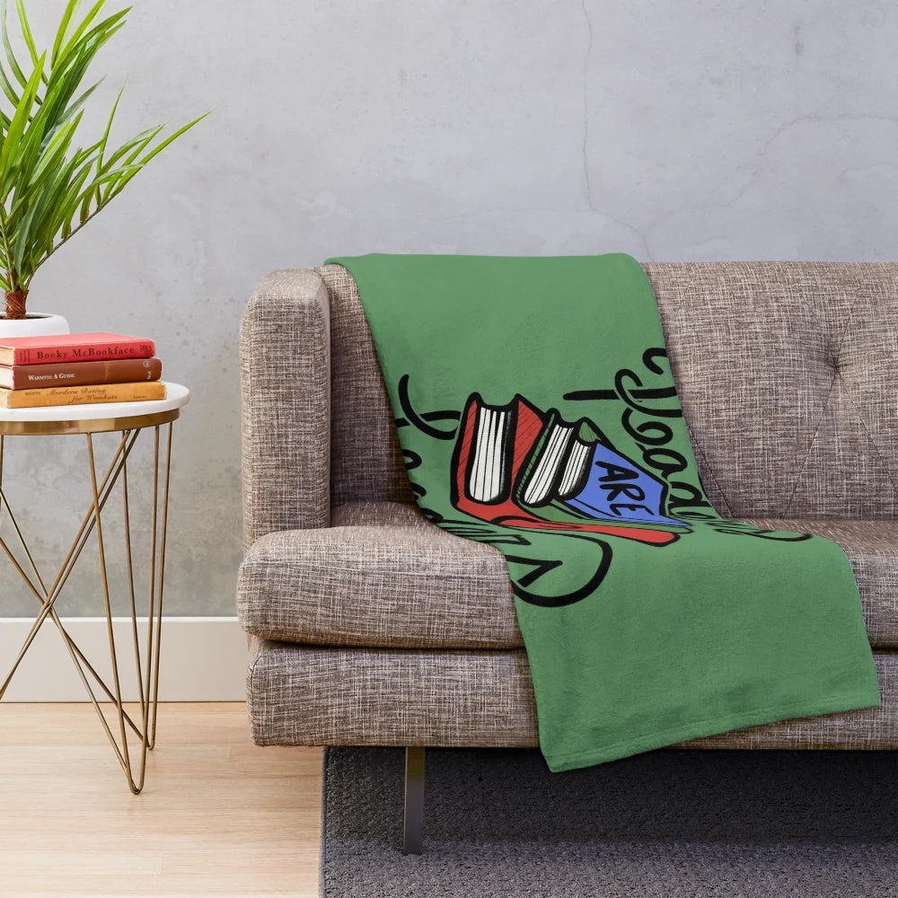 Soft, plush blanket featuring the "Readers Are Leaders" design for book lovers