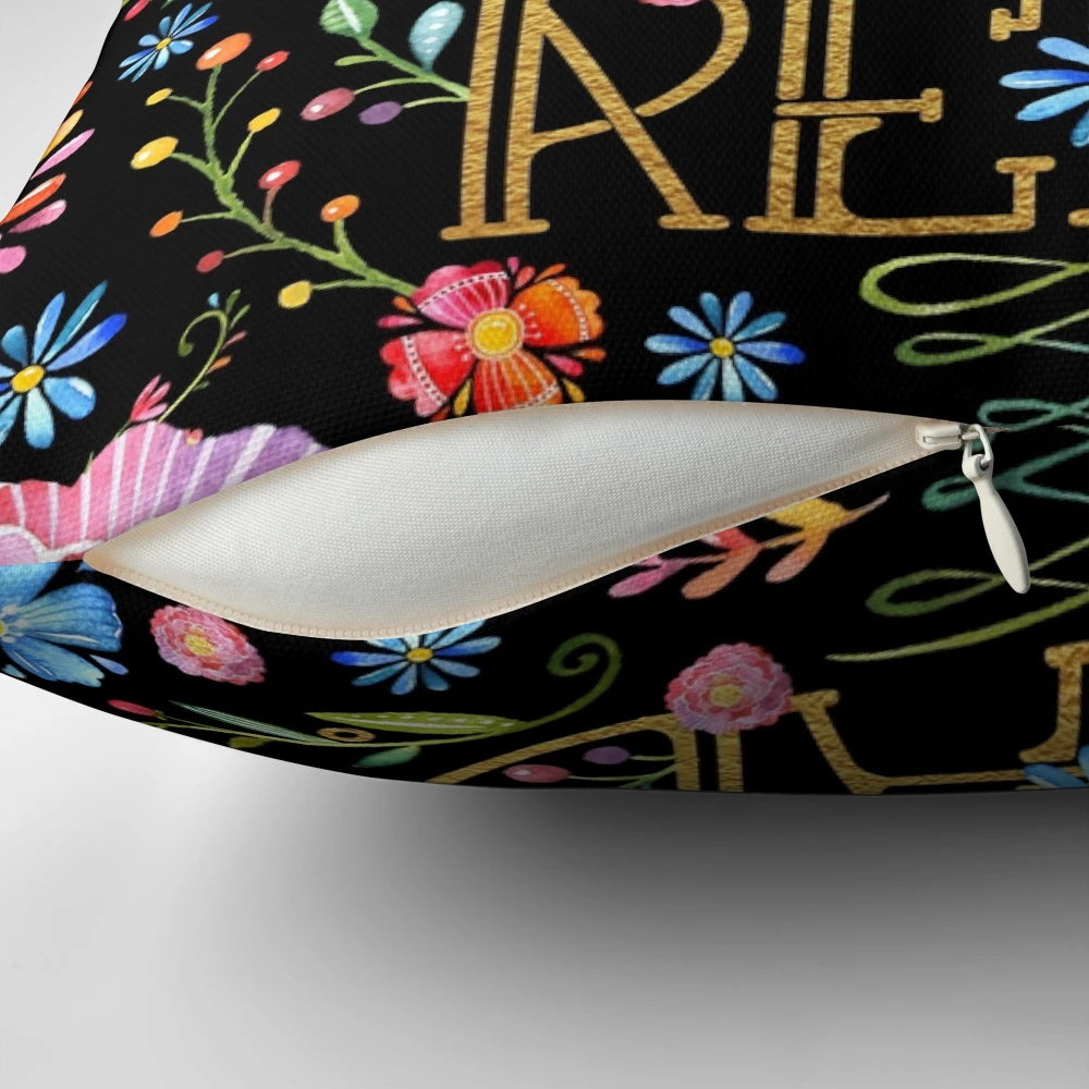 A black floral pillow with a whimsical design, perfect for bookworms and readers to enjoy.
