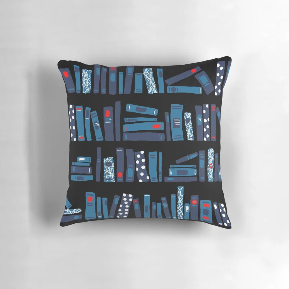 Black decorative pillow with a book-themed pattern, perfect for readers and book enthusiasts.