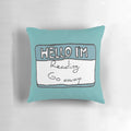 A blue pillow with the text "Hello I'm Reading" in a fun, hand-drawn style.