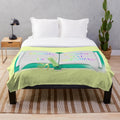 Plush blanket featuring the text "Reading is Guided Daydreaming