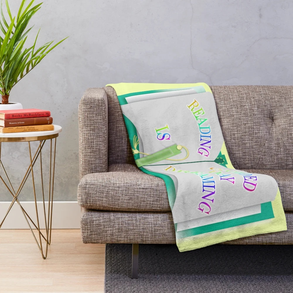 Plush blanket featuring the text "Reading is Guided Daydreaming